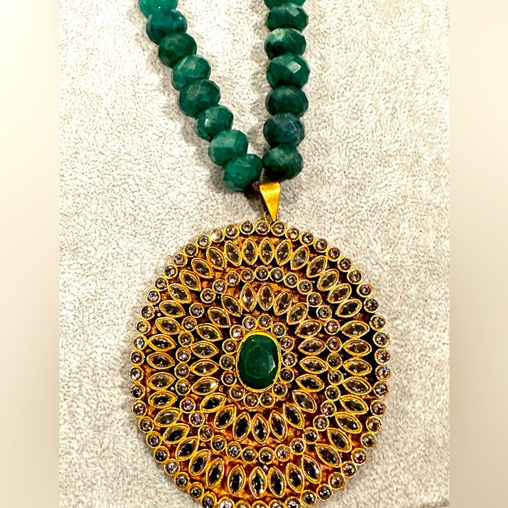 Green beaded necklace with large pendent